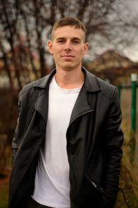 Portrait of young man standing outdoors
