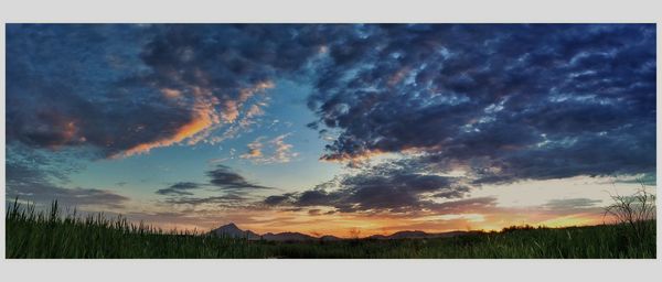 Scenic view of dramatic sky over landscape