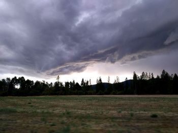 Panoramic view of field against sky