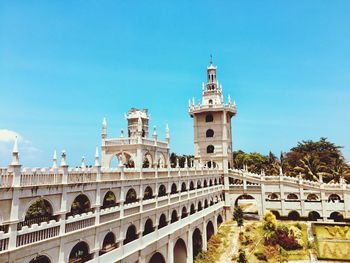 Low angle view of historical building against blue sky