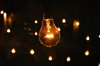 Close-up of illuminated light bulb