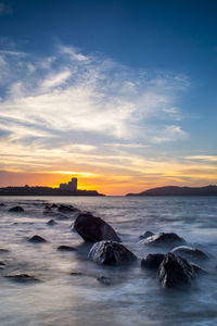 Scenic view of sea at sunset