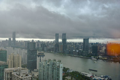 Modern buildings in city against sky