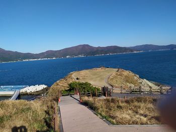 Scenic view of sea against clear blue sky