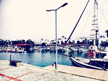 Boats moored at harbor