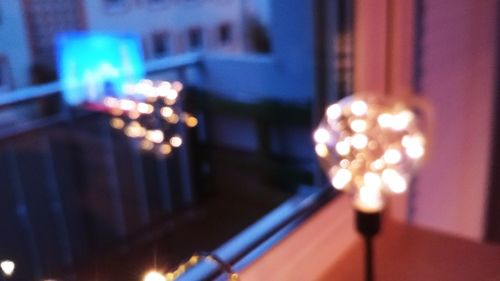 Defocused image of illuminated lights at night