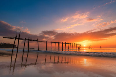 Scenic view of beach against sky during sunset