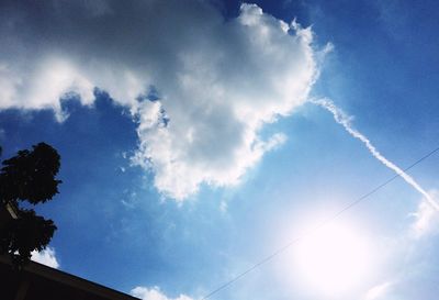 Low angle view of vapor trails in sky