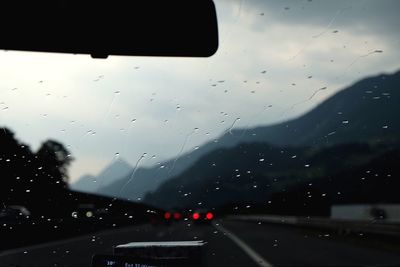 Road seen through car windshield