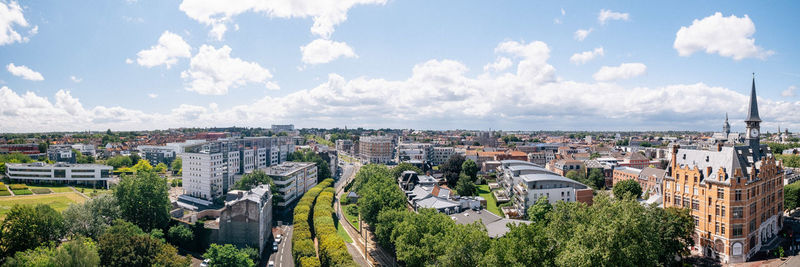 High angle view of trees and buildings against sky