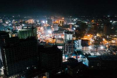 High angle view of illuminated buildings in city at night