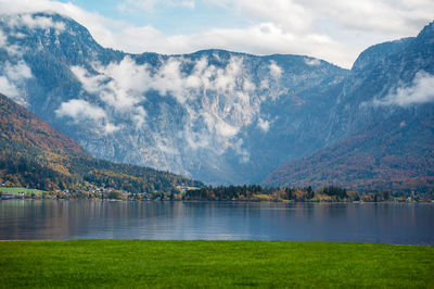 Scenic view of lake and mountains against sky
