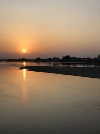 Scenic view of sea against romantic sky at sunset