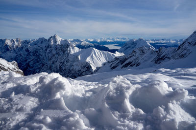 Scenic view of snowcapped mountains against sky