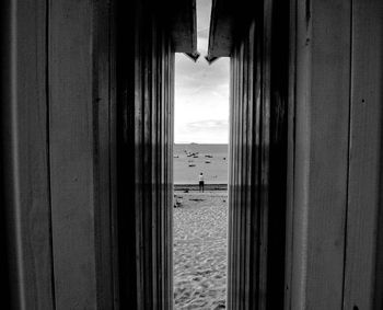 Beach seen through huts