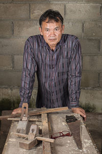 Carpenter working in carpentry workshop