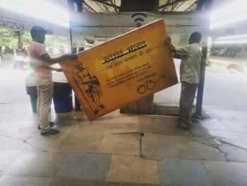 People standing on street in city