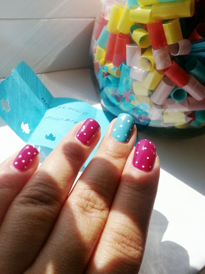 person, part of, holding, human finger, cropped, personal perspective, unrecognizable person, indoors, close-up, nail polish, food and drink, showing, multi colored, sweet food, food, palm