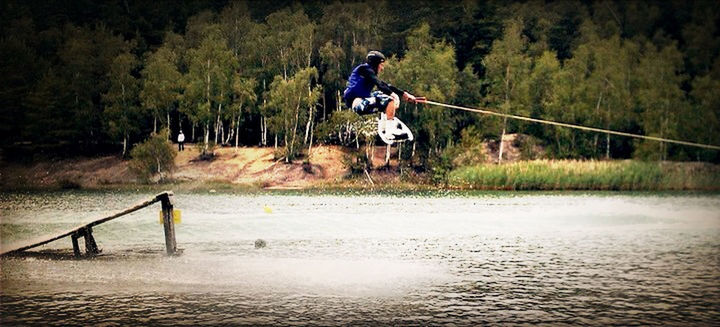 full length, water, leisure activity, lifestyles, tree, men, boys, waterfront, jumping, enjoyment, vacations, childhood, forest, casual clothing, river, fun, lake, nature