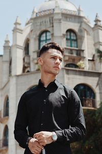 Young man standing outdoors