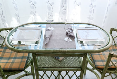 Close-up of empty chairs and tables in restaurant