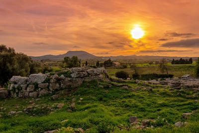 Scenic view of landscape against sky during sunset