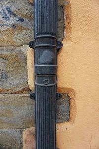 Close-up of old pipe on wall