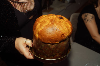 Midsection of man holding food