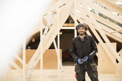 Portrait of male construction worker at construction site