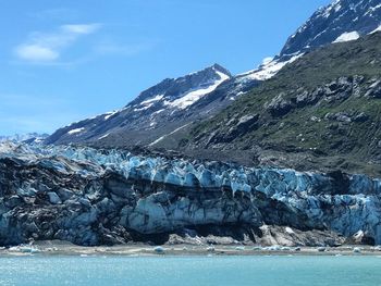 Scenic view of snowcapped mountain against blue sky