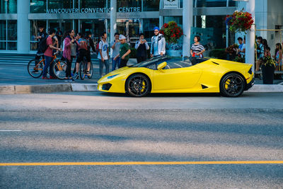 Yellow car on street in city