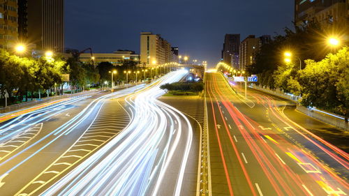 High angle view of light trails on road at night