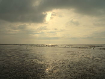 Scenic view of sea against sky at sunset