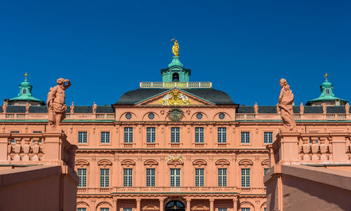 Low angle view of building against blue sky