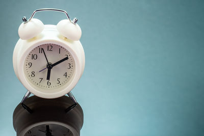 Low angle view of clock on wall