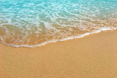 High angle view of surf on beach