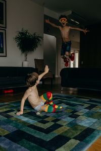 Boy playing with swimming pool at home