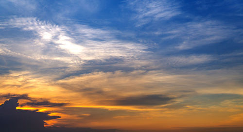 Low angle view of cloudy sky during sunset