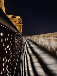 Low angle view of illuminated building against sky at night