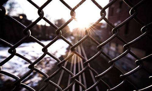 Chainlink fence seen through chainlink fence