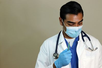 Mid section of a man wearing eyeglasses