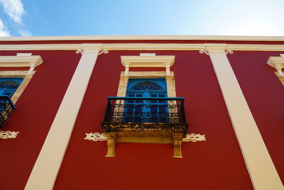 Low angle view of illuminated building against sky