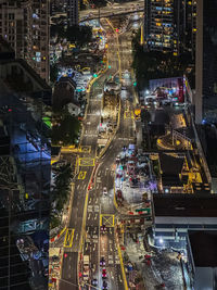 High angle view of illuminated buildings in city at night