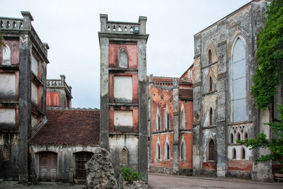 Old building in city against sky