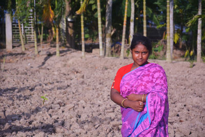 Portrait of girl standing on land