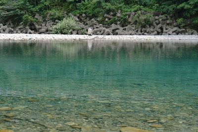 Scenic view of river against tetrapods