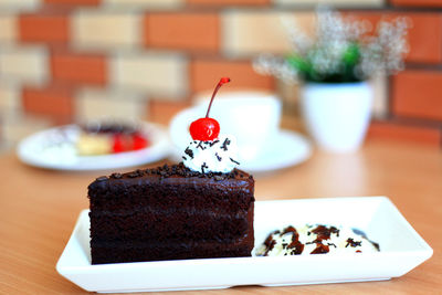 Close-up of cake served on table