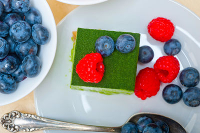 High angle view of fruits in plate on table