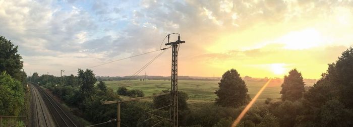 Scenic view of field against sky during sunset