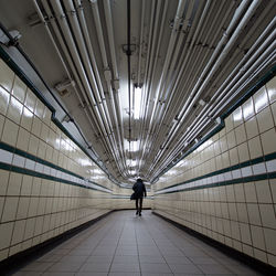 Rear view of woman on subway station